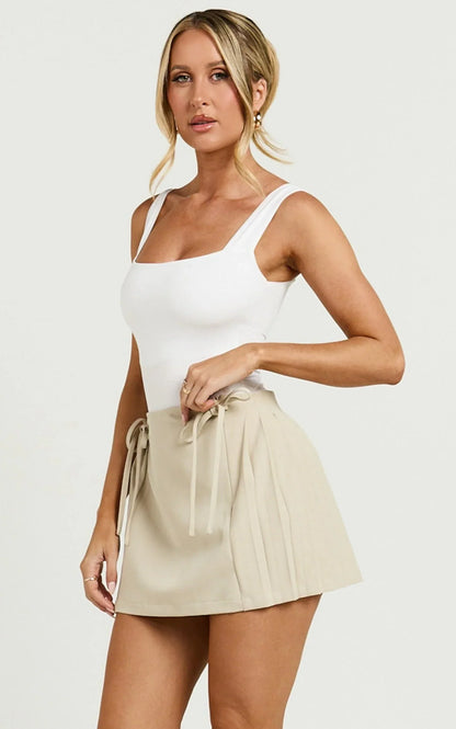 Camilla Mini Skirt - Mid Waist Pleated Back Bow Detail Skirt in Stone