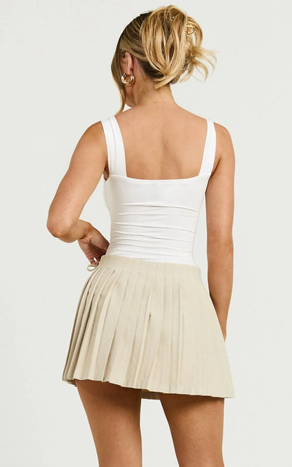 Camilla Mini Skirt - Mid Waist Pleated Back Bow Detail Skirt in Stone