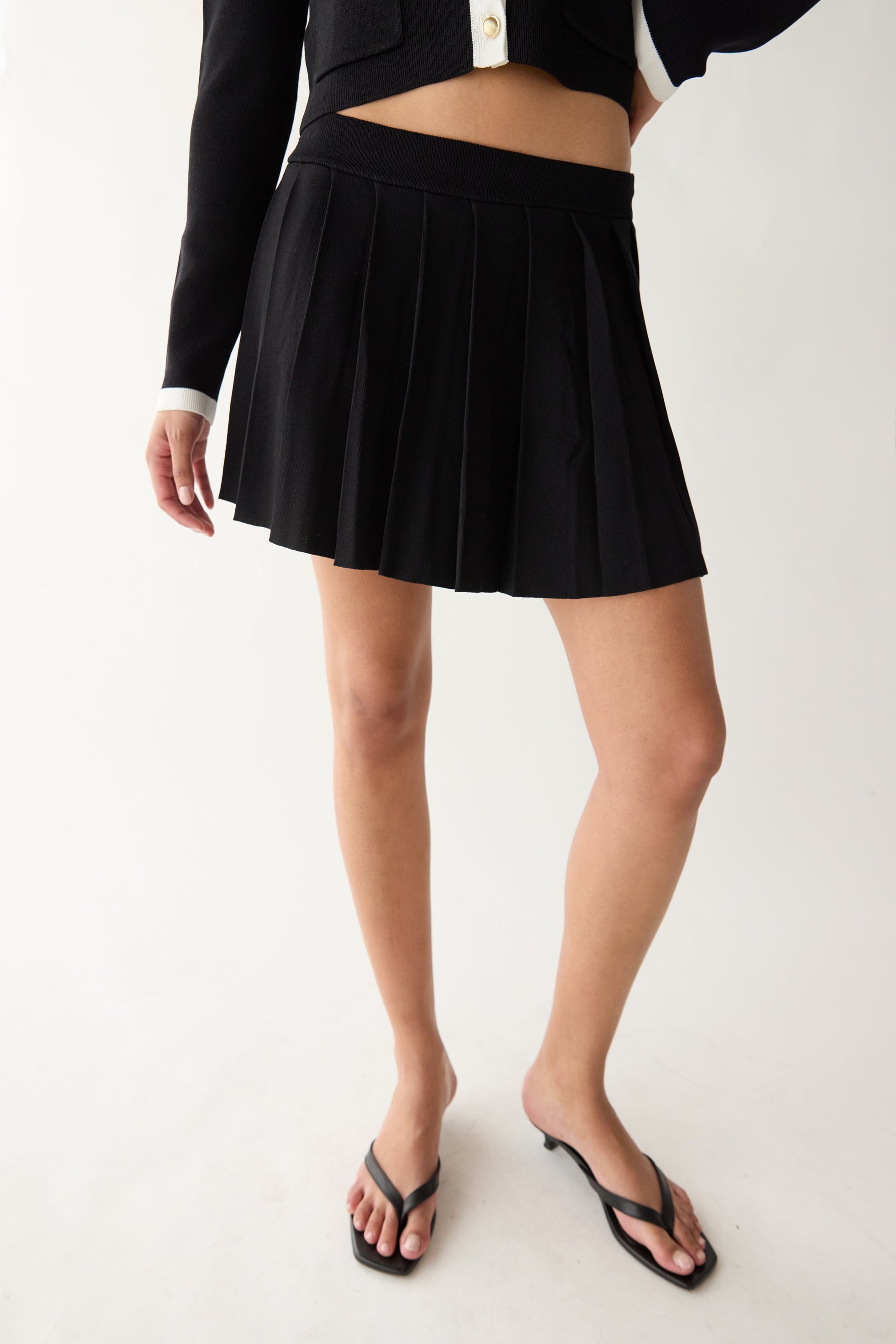 PLEATED KNIT MINI SKIRT