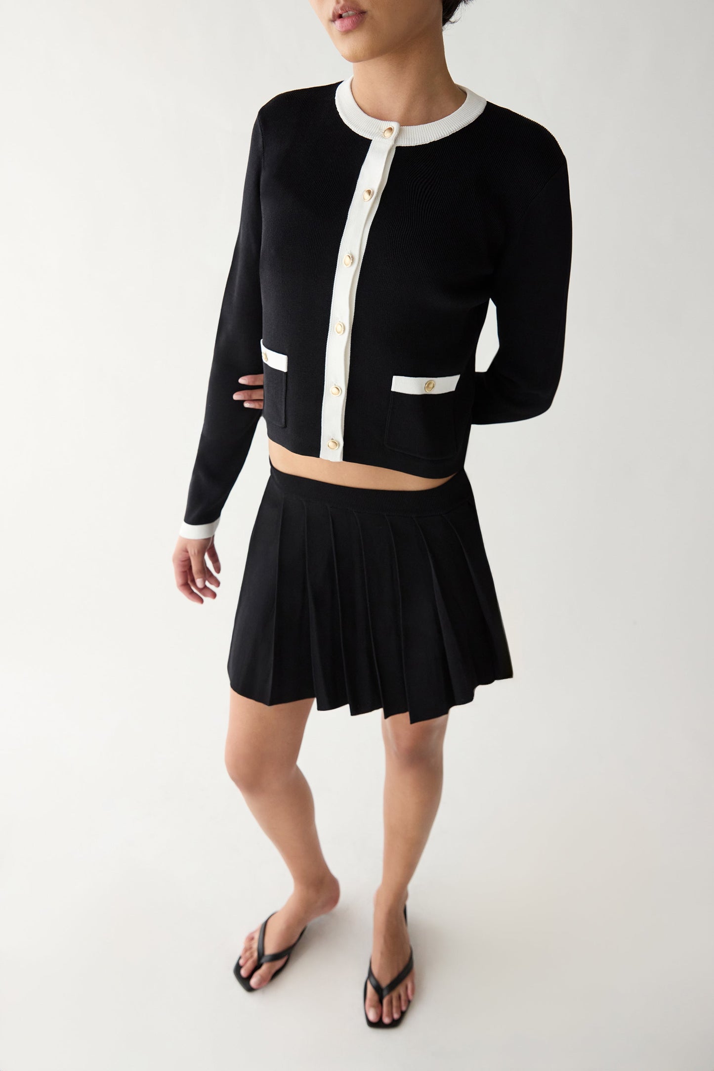 PLEATED KNIT MINI SKIRT
