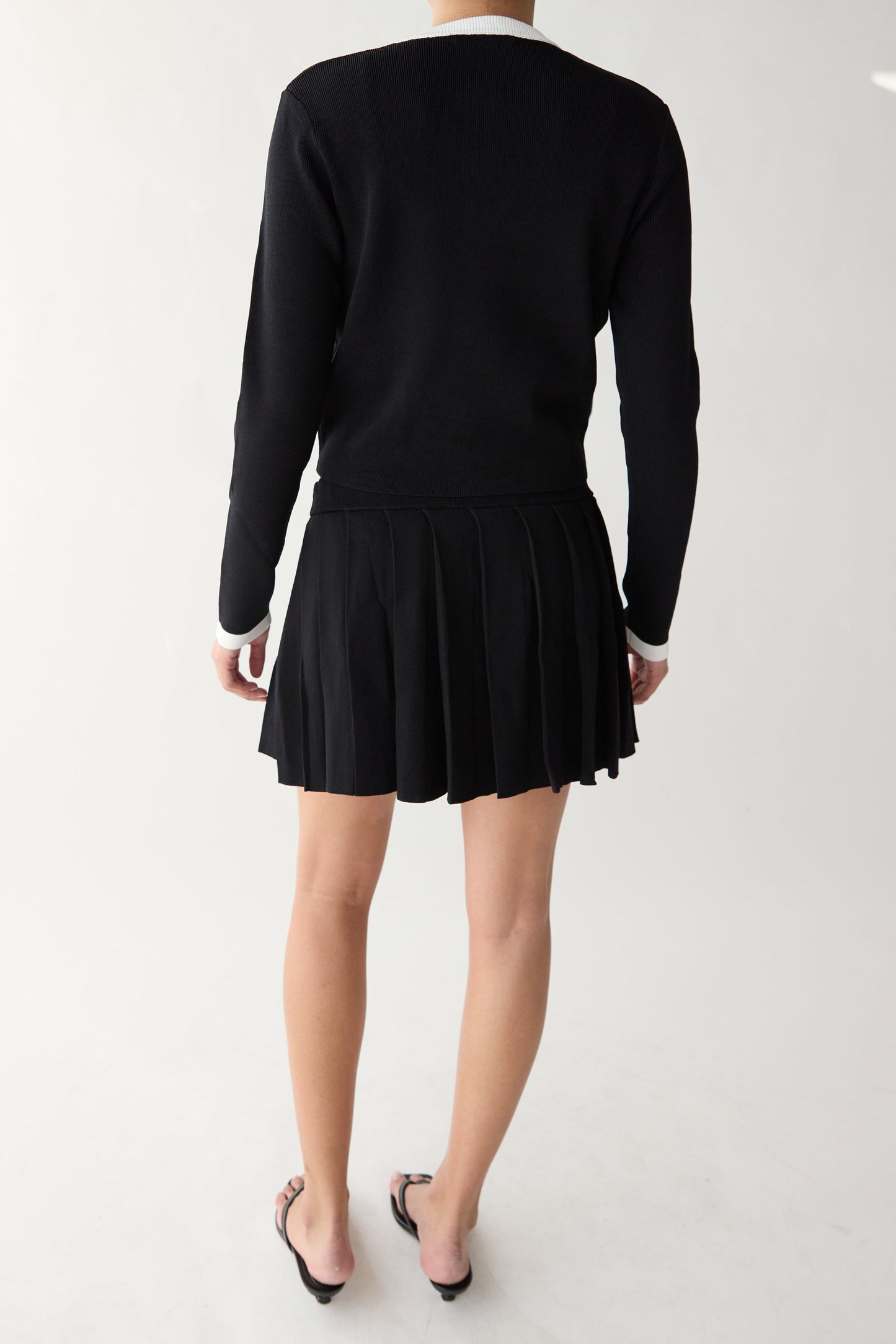 PLEATED KNIT MINI SKIRT