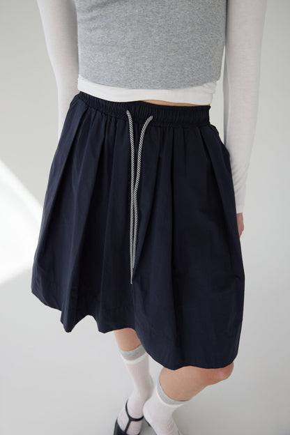 PLEATED DRAWSTRING MIDI SKIRT