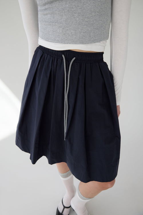 PLEATED DRAWSTRING MIDI SKIRT